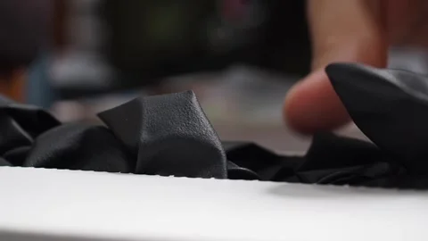 Macro shot female hand pulling black latex glove from white box. Hygiene Video stock 279305513