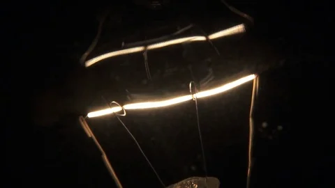 Macro shot of filament turning on. Stock Footage 72607568
