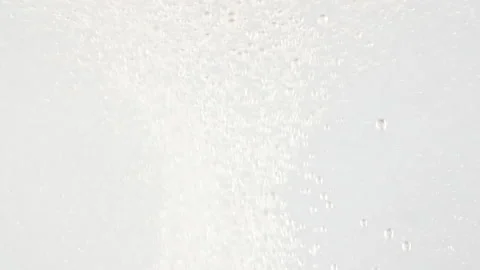 Macro shot of fine air bubbles rising in water on white background. Effervescent Stock-Footage 165921350