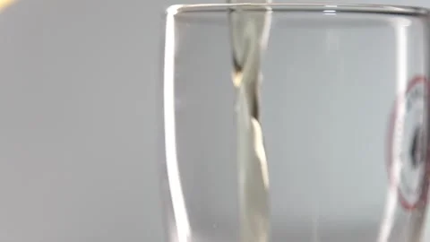 Macro Shot Of Fine Bubbles Rising In A Glass With Orange Liquid Stock Footage 130235589