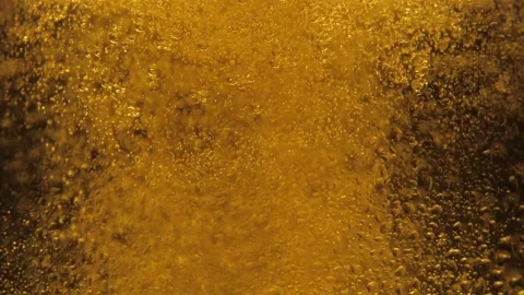 Macro Shot Of Fine Bubbles Rising In A Glass With Orange Liquid. Slow Motion Stock Footage 146260306