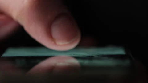 Macro shot of a finger doom scrolling social media or browsing internet Stock Footage 234663136