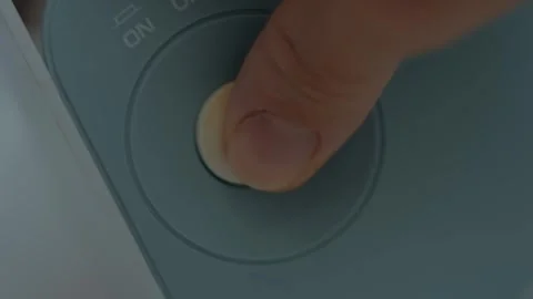 Macro shot of finger pressing button to start the nebulizer working. Medical Stock Footage 253104679