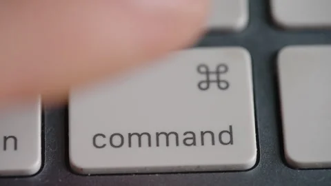 Macro Shot Of Finger Pressing Command Key On Apple Keyboard Stock Footage 328582742