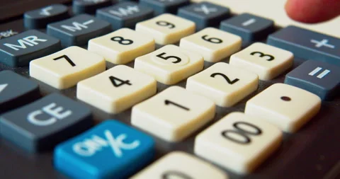 Macro shot of a finger pushing calculator buttons Stock Footage 332061987