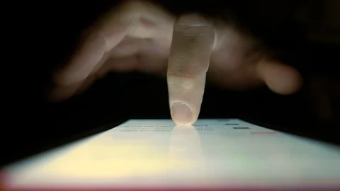 Macro Shot. Finger scrolls text on smartphone screen Vídeos de archivo 100006446