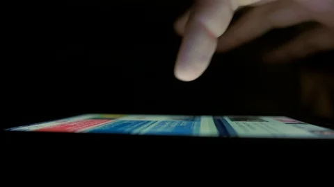 Macro Shot. Finger scrolls text on smartphone screen Stock Footage 100006472