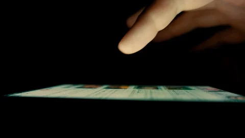 Macro Shot. Finger scrolls text on smartphone screen Stock Footage 100023161