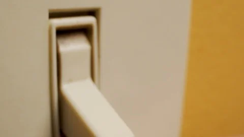 Macro shot of a finger turning on a light switch Stock Footage 111809652