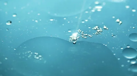 Macro shot of floating oil drops on water Stockbeeldmateriaal 55510271