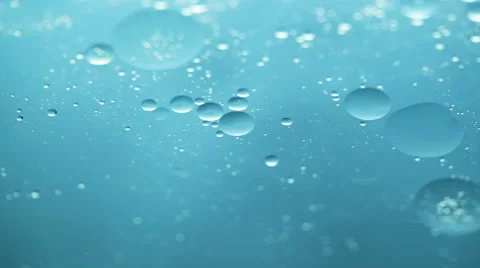 Macro shot of floating oil drops on water Stock-Footage 55510473