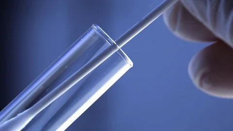 Macro shot of forensic csi police officer putting buccal swap with blood samp Stock Footage 117690575