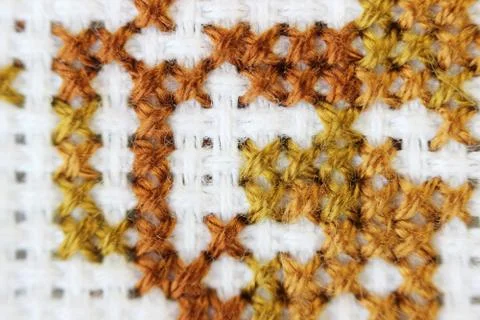 Macro shot fragment embroidery pattern brown thread handmade embroidery Stock Photos