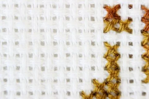 Macro shot fragment embroidery pattern brown thread handmade embroidery 스톡 사진