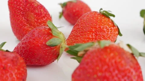 Macro shot of fresh red colored strawberries Stock Footage 148216681