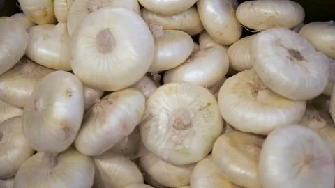 Macro shot of fresh white onions in bulk Vídeo Stock 314890906