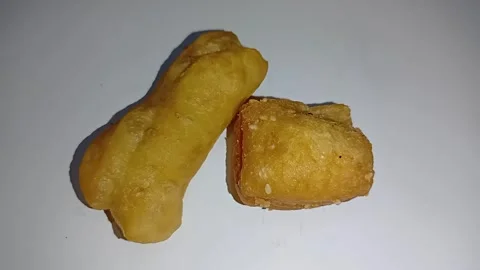 Macro Shot of Freshly Baked Cake and Golden Fried Bread Texture Stock Footage 329387397