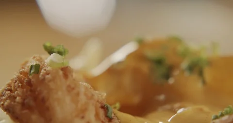Macro shot of fried shrimp in breadcrumbs dipped in sauce. 4K Slow Motion Stock Footage 116238481