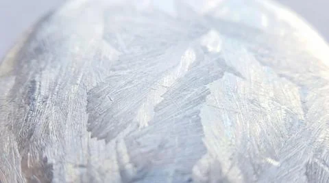Macro shot of frost patterns on a metallic surface, intricate crystalline i.. Illustrazione stock