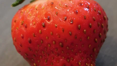 Macro shot of fruit being cut down the center Stock Footage 258095831