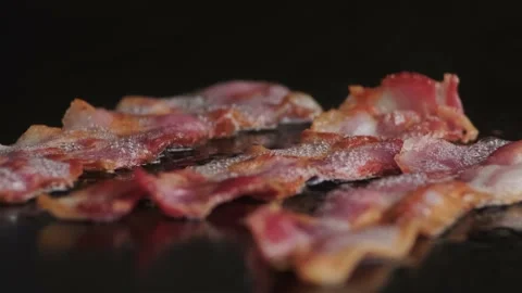 Macro shot of frying bacon strips on grill. Stock Footage 140328797