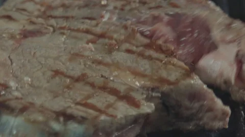 Macro shot of a frying steak Stock Footage 92179455