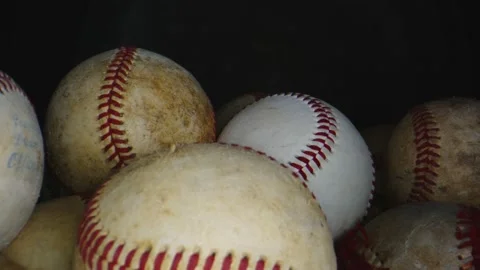Macro shot of group of baseball balls with black background Stock Footage 131690300