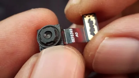 Macro Shot of Hand Holding Smartphone Camera Module Stock Footage 310364941