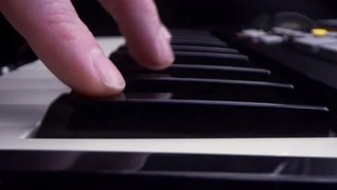 Macro shot of hands of a person playing piano Stock Footage 150226407