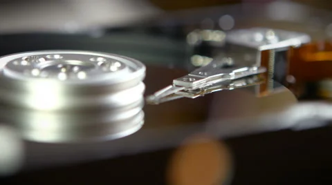 Macro shot of a hard disk rotating and turning Stock Footage 64073578