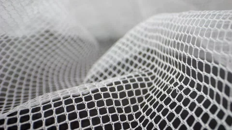 Macro shot highlighting the texture and pattern of white lace curtain fabri.. Stock Footage 259048741
