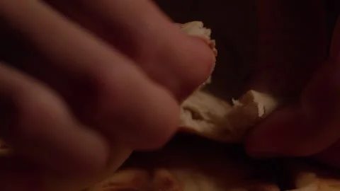 Macro Shot Of Holy Communion Bread Being Broken Stock Footage 219594524