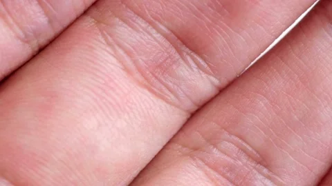 Macro shot of human skin texture and finger knuckles Video stock 332284773