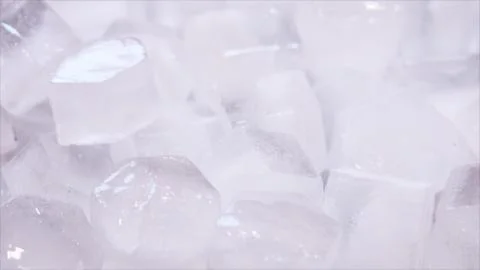 Macro shot of ice cubes from clear water that melt in slow motion on a white  Stockillustratie