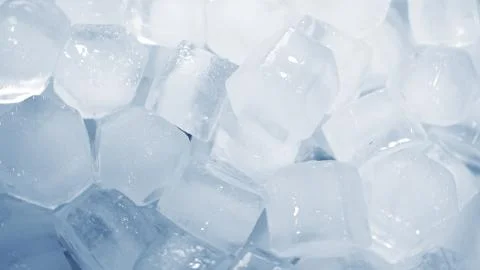 Macro shot of ice cubes from clear water that melt in slow motion on a white  イラスト素材