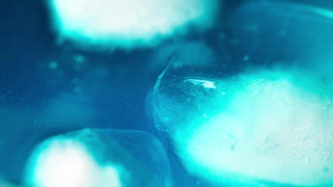 Macro shot of ice cubes inside a blue cocktail Stock Footage 323027869