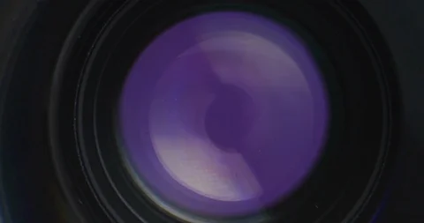 Macro shot from inside camera lens moving to outside of lens Stock Footage 105677219