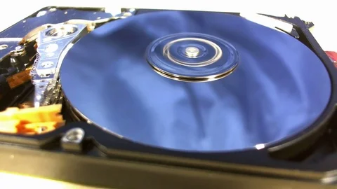 Macro shot of the inside workings of a computer hard disk drive. Stock Footage 75639435
