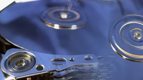 Macro shot of the inside workings of a computer hard disk drive. Stock Footage 75658032