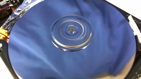 Macro shot of the inside workings of a computer hard disk drive. Stock Footage 75664032