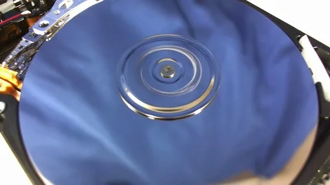 Macro shot of the inside workings of a computer hard disk drive. Stock Footage 75671649