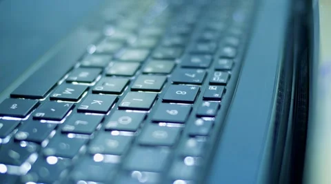 MACRO shot of a keyboard. 4k beautiful laptop keyboard with lights, soft focus Stock Footage 64216845