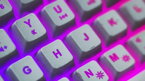 Macro shot of keyboard button focus on letter H. Rgb keyboard Stock Footage 301077355