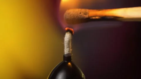 Macro shot of lighting a candle with a match Stock Footage 257267427