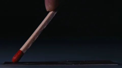 Macro shot of lighting a match. Stock Footage 100550180