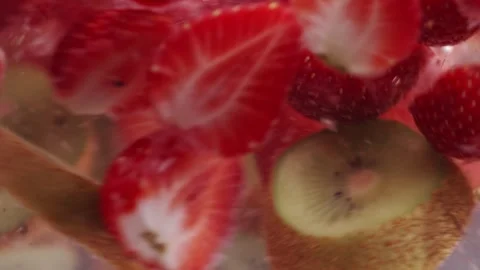 Macro Shot of Making Fresh Lemonade from Strawberry and Kiwi Stock Footage 246806277