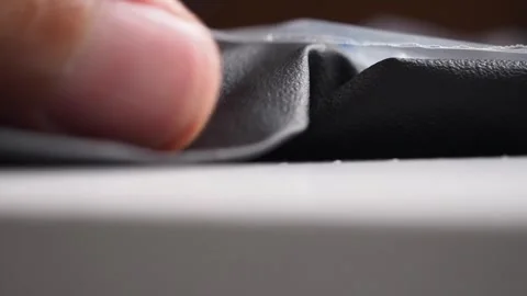 Macro shot male hand pulling black latex glove from white box. Hygiene Stock Footage 279305353