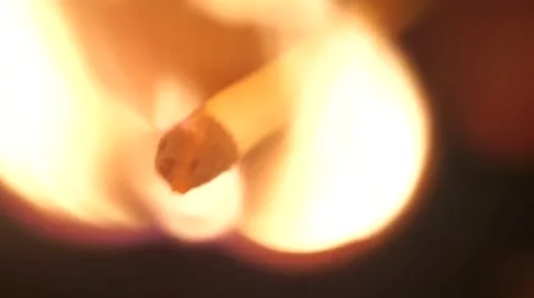 Macro shot of man lighting up a match in the dark Video stock 57313837