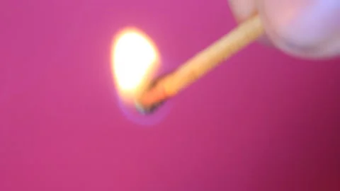 Macro shot from a man lighting a match and watching it fade away Stock Footage 228822595