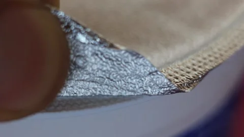 A macro shot from a man opening a package of butter  Stock Footage 225089219